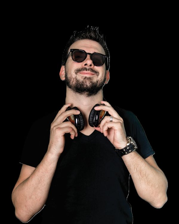 DJ Stephen Craig, headphones, on black